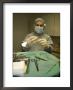 A Surgeon Readies A Scalpel In An Operating Room Prior To Surgery, Washington, D.C. Usa by Taylor S. Kennedy Limited Edition Print