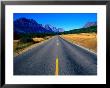 Road With Mountain Range In Distance Glacier National Park, Montana, Usa by Rob Blakers Limited Edition Print