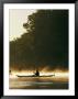 A Kayaker Paddles Through The Mist In The Low Sunlight by Skip Brown Limited Edition Pricing Art Print