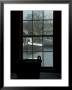 Looking Out Through A Window At Wooden Fishing Boats On A River by Todd Gipstein Limited Edition Pricing Art Print
