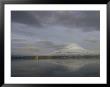 Volcanic Mountain And Clouds With Reflections In Calm Water by Klaus Nigge Limited Edition Print