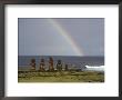 A Rainbow Arches Above Statues Carved From Volcanic Rock by James P. Blair Limited Edition Print