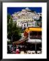 Waterfront Restaurant With Steep Terrace Of Houses In Background, Positano, Italy by Dallas Stribley Limited Edition Print
