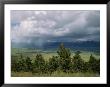 A Rainstorm Breaks Over The Flathead Valley by Annie Griffiths Belt Limited Edition Print