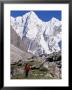 A Man Hikes Through The Karakoram Range, Pakistan by Jimmy Chin Limited Edition Pricing Art Print