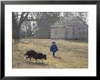 A Young Male And His Sheltie Dog Walk Through A Historic Farm by Joel Sartore Limited Edition Print