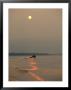 A Jet Boat Cruises Down The Mackenzie River At Sunset by Raymond Gehman Limited Edition Print