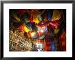 Brightly Dyed Wool Hanging From Roof Of A Shop, Marrakech, Morrocco, North Africa, Africa by John Miller Limited Edition Print