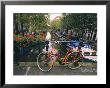 The Keizersgracht Canal, With Potted Flowers And A Bicycle In The Foreground by Richard Nowitz Limited Edition Print