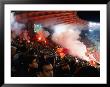 Flares In Curva Sud Stand At Champions League Game Stadio Olimpico, Rome, Italy by Martin Moos Limited Edition Print