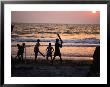 Kids Playing Beach Cricket In Arambol by Paul Bigland Limited Edition Print