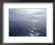 Calm Ocean With Small Ripples Reflects A Sunbeam Off The Surface, Australia by Jason Edwards Limited Edition Print