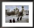 Russian Women, Dressed In Black, Walk Across A Snowy Square Toward Two Orthodox Churches by James L. Stanfield Limited Edition Print