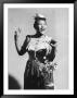 Singer Ella Fitzgerald Holding A Basket Of Flowers As She Sings A Tisket, A Tasket by Eliot Elisofon Limited Edition Print