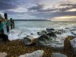 Sea Defences At Hurst Spit, Looking Across To The Isle Of Wight And The Needles, Hampshire, England by Adam Burton Limited Edition Print