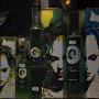 Shop Window Bottles Green Boxes Printed Faces Red Blue Green Blac White Yellow by Mike Burton Limited Edition Print