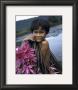 Cambodian Boy, Harvesting Water Lilies by Russel Young Limited Edition Print