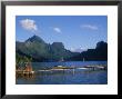 Traditional Outrigger Canoes With Sailboats by Barry Winiker Limited Edition Print