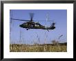 March 31, 2007, A Us Army Uh-60 Black Hawk Helicopter Prepares To Pick Up Soldiers by Stocktrek Images Limited Edition Print