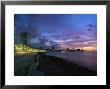 Twilight View Of Young Cubans Sitting On City's Seawall by Steve Winter Limited Edition Pricing Art Print