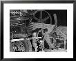 African American Worker Mrs. Rosalie Ivy Using Shovel To Mix A Special Mud Used To Seal The Hole by Margaret Bourke-White Limited Edition Pricing Art Print