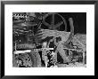 African American Worker Mrs. Rosalie Ivy Using Shovel To Mix A Special Mud Used To Seal The Hole by Margaret Bourke-White Limited Edition Print