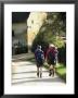 Two Walkers With Rucksacks On The Cotswold Way Footpath, Stanton Village, The Cotswolds, England by David Hughes Limited Edition Print