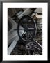 Old Ship's Wheel, Chains And Wood Planks Against A Cedar Wall, Mystic, Connecticut by Todd Gipstein Limited Edition Print
