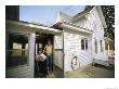 A Man And A Woman In A Wheelchair At A Screen Door by Joel Sartore Limited Edition Print