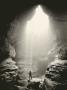 A Man Stands In Front Of A Skylit Cave Waterfall by Stephen Alvarez Limited Edition Pricing Art Print