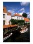 Houses And Boats With Tourists, Canals Of Bruges, Belgium by Bill Bachmann Limited Edition Print