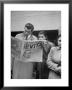 Couple Reading Newspaper Account Of The Death Of Evita Peron At 33 From Cancer by Alfred Eisenstaedt Limited Edition Print