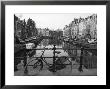 Black And White Imge Of An Old Bicycle By The Singel Canal, Amsterdam, Netherlands, Europe by Amanda Hall Limited Edition Print