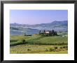 Val D'orcia, Countryside View, Farmhouse And Green Grass And Hills, Tuscany, Italy by Steve Vidler Limited Edition Print