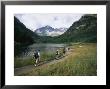 Group Of Hikers In Front Of The Maroon Bells, In Colorado by Taylor S. Kennedy Limited Edition Pricing Art Print