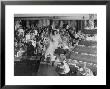 At Palumbo's Cafe, Bride Mrs. Salvatore Cannella Walks Onto Stage, Facing A Revolving Cake Display by Cornell Capa Limited Edition Print