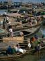 Local Boats Loading And Unloading Goods, Mawlamyaing, Mon State, Myanmar (Burma) by Bernard Napthine Limited Edition Print