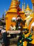 People Making Offerings Amongst The Statues Of Deities At The Base Of Shwedagon Paya, Myanmar by Juliet Coombe Limited Edition Print