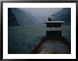 Man Changes A Lightbulb On A Barge Near The Three Gorges by Eightfish Limited Edition Print