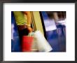 Person With Shopping Bags Entering A Carriage Of The Skytrain, Bangkok, Thailand by Ray Laskowitz Limited Edition Print