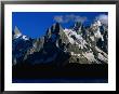 Walker Silhouetted Against Chamonix Needles On Route Of Tour Du Mont Blanc, Mont Blanc, France by Gareth Mccormack Limited Edition Print