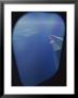 A View Out Of An Airplane Window Over Water And Nearby Islands by Roy Gumpel Limited Edition Print