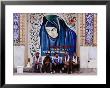 A Group Of Men Sitting In Front Of A Mural In The Courtyard Of The Tomb Of Prophet Daniel, Iran by Patrick Syder Limited Edition Print