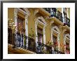 Spain, Sevilla, Andalucia Geraniums Hang Over Iron Balconies Of Traditional Houses by John & Lisa Merrill Limited Edition Pricing Art Print