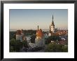 Medieval Town Walls And Spire Of St. Olavs Church At Dusk, Tallinn, Estonia, Baltic States, Europe by Neale Clarke Limited Edition Print