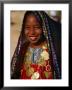 Girl In Traditional Dress At Sahara Festival, Looking At Camera, Douz, Tunisia by Craig Pershouse Limited Edition Print