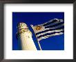 Faro Del Cabo De Santa Maria Lighthouse And Uruguayan Flag, La Paloma, Rocha, Uruguay by Krzysztof Dydynski Limited Edition Print