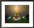 Eiffel Tower Illuminated In Fog And Rain At Night, Paris, France by Jim Zuckerman Limited Edition Pricing Art Print