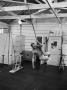 Actor Steve Mcqueen Swinging On Rope In Room With Workout Equipment by John Dominis Limited Edition Pricing Art Print