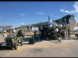 Team Uploading Air Launch Cruise Missile In 1985 Weapons Load Competition At Ellsworth Afb by Rose S. Reynolds Limited Edition Print